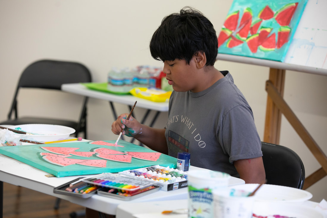 Student creating an acrylic painting in a teen class during Summer Art Camp at Catherine Carter Art School in New Bedford.