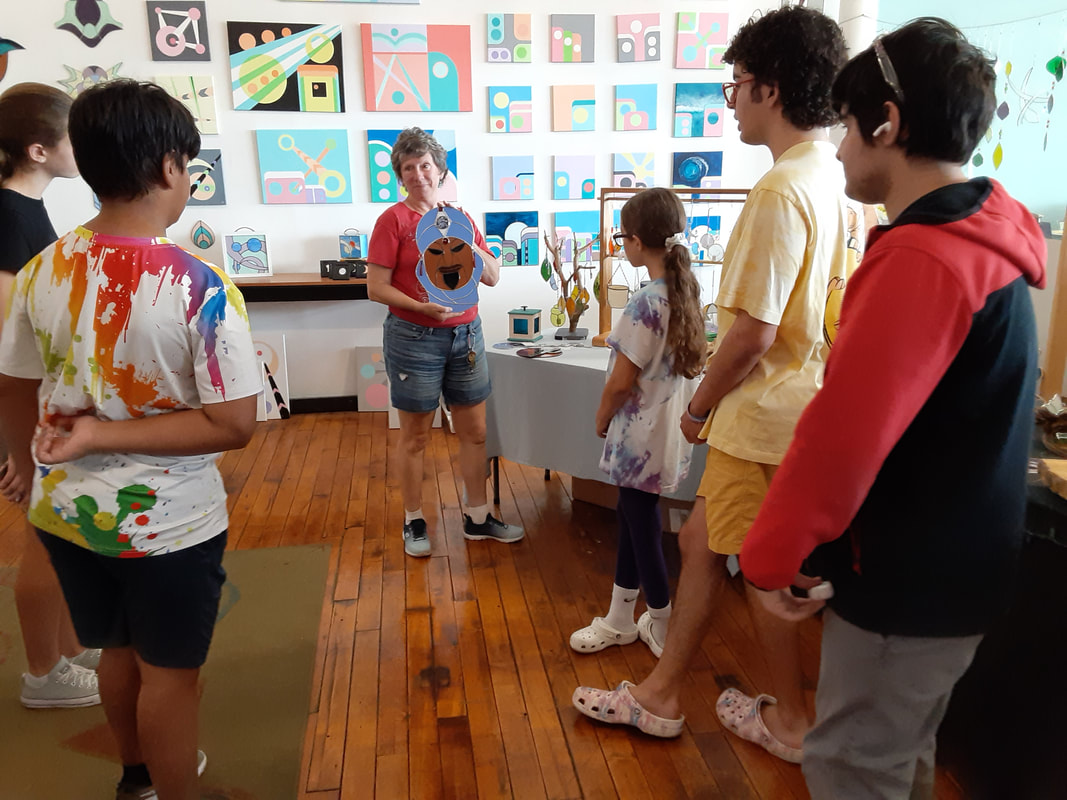 Teen art class from Catherine Carter Art School visits artist Michelle Lapointe, the Glass Connector, in her art studio at Hatch Street Studios in New Bedford, MA.