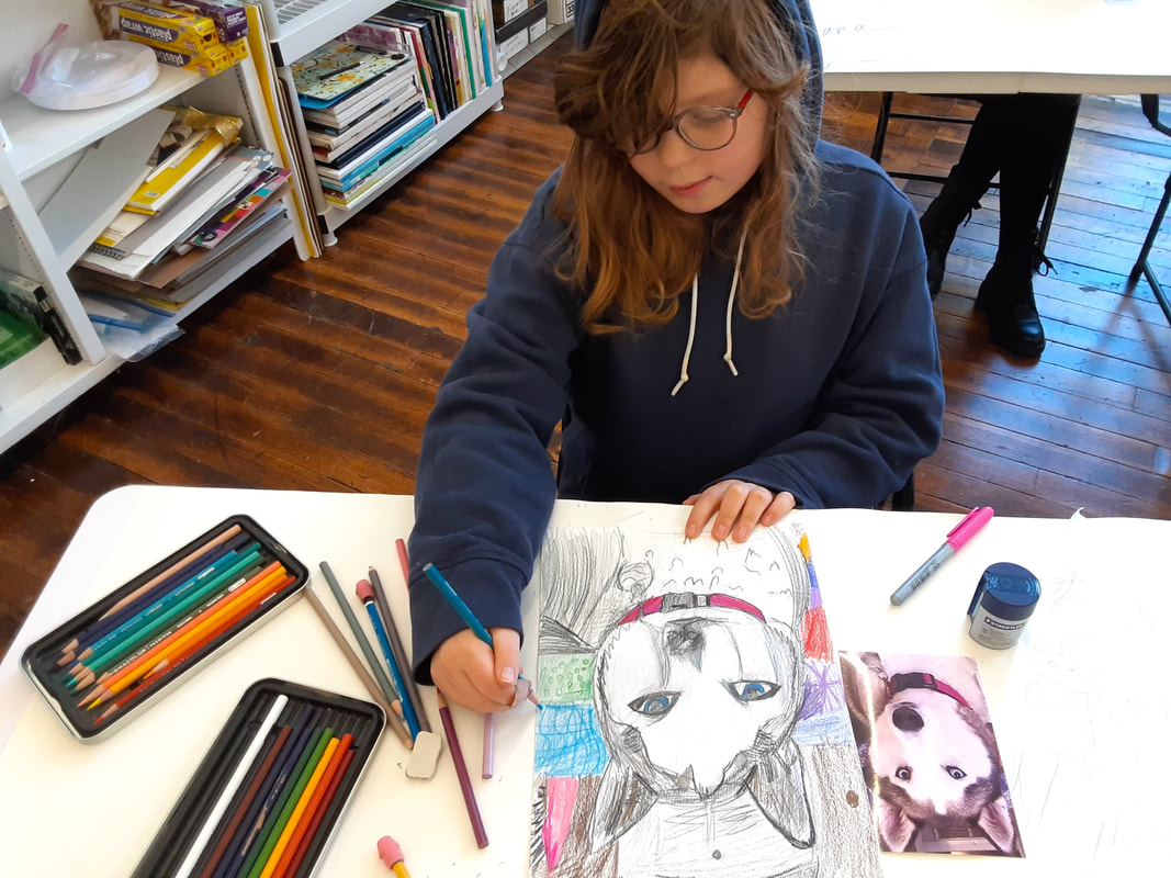 Student drawing in the art classroom at Catherine Carter Art School in New Bedford, MA.