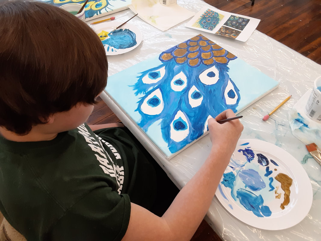 Student creates an acrylic painting in a teen art class at Catherine Carter Art School in New Bedford, Massachusetts.
